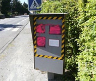 Pink spraypaint speed camera