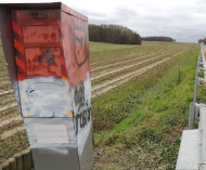 Red and white painted speed camera